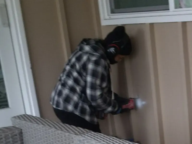 Professional electrician installing an exterior outlet in Woodland